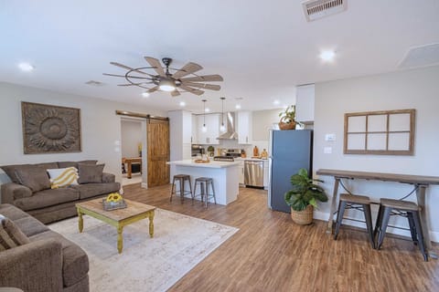 Living Room: Bright, airy space with comfy seating and modern touches—perfect for relaxing after adventures!