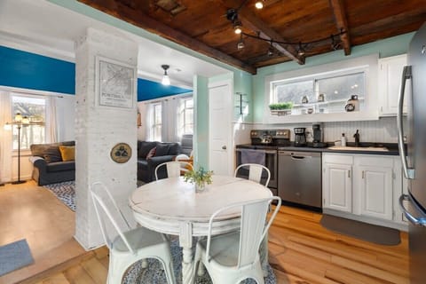 Fully equipped kitchen with updated appliances and 4 person dining table.