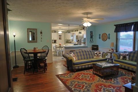 Couch, love seat, table with 4 stools and bar with 2 stools