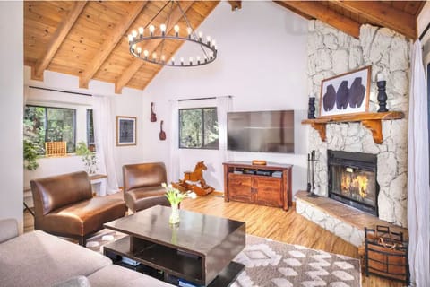 Great Room with cozy wood burning fireplace and amazing views