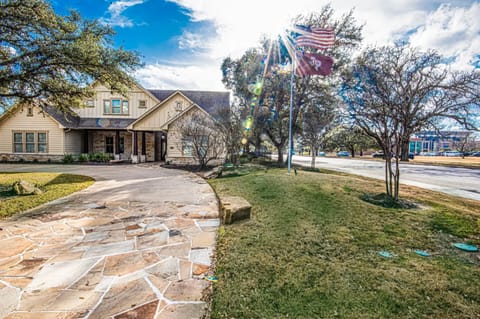 Front view of house - street pictured is George Bush Drive