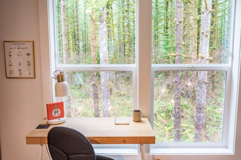 Upstairs work desk w/ view of the forest