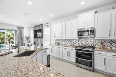 You will love the kitchen with its upgraded appliances and beautiful granite countertops.