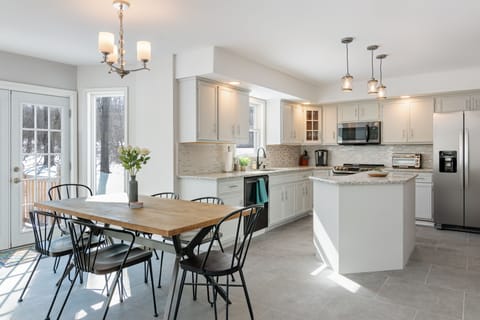 The bright and modern kitchen has everything you need to cook for a large family