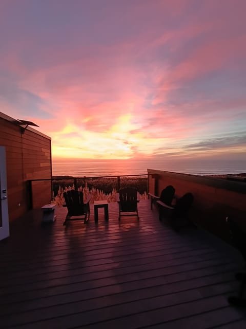 Amazing ocean sunset from large rooftop deck