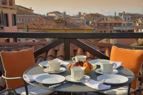 The private terrace of the Cassia apartment also has a dining table for four.