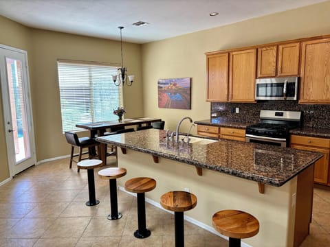 Spacious open-concept kitchen and living room.