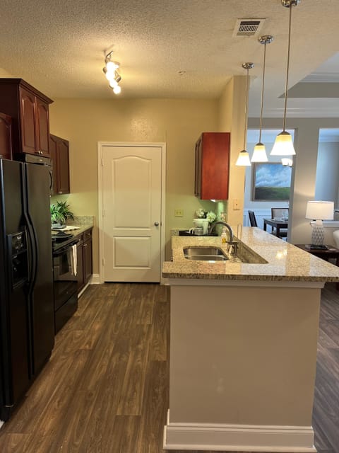 Gallery Kitchen with door to Full Size Washer and Dryer