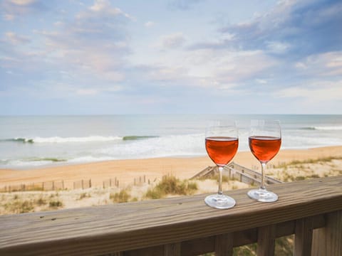 Unwind with ocean views and sunset drinks just steps from the sand — your private balcony retreat.