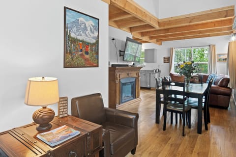 Open-concept living with exposed beams and cozy mountain charm