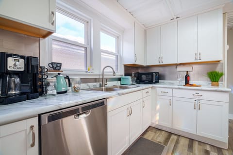 You have all you need in this kitchen! Microwave, toaster, kettle, drip & single serve coffee, and coffee grinder