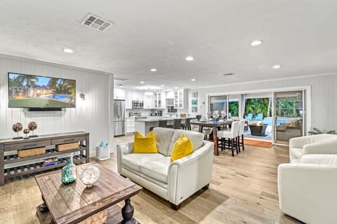 Experience the seamless flow from the living room into the open-concept kitchen and dining areas.