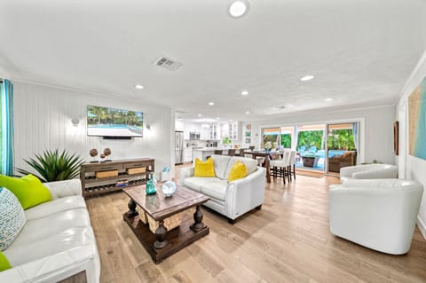 Sink into plush sofas in this elegant living space, designed for relaxation and cherished conversations.