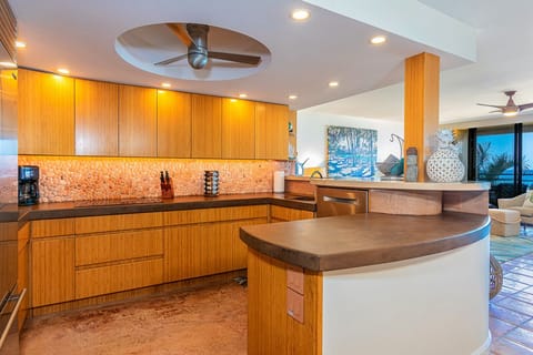 Well appointed kitchen with lots of light and recessed fan