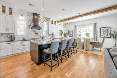 Channel your inner chef in this stunning open concept kitchen, fully equipped with high-end appliances and sleek countertops, making cooking a luxurious experience.