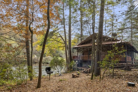 Riverside play area with firepit and grill.