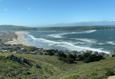 Farol views! From great room, decks and lower front bedrooms