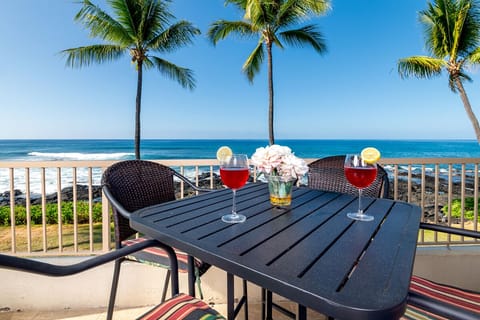 Amazing Ocean Front Condo! Dine, relax, or read on your private balcony overlooking the sparkling saltwater pool and the Pacific Ocean.