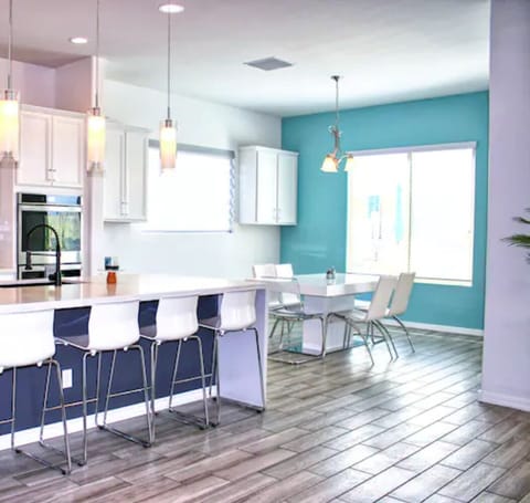 Dining room extends to seating for 10.