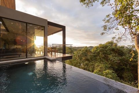 Sunset over your private infinity edge pool.