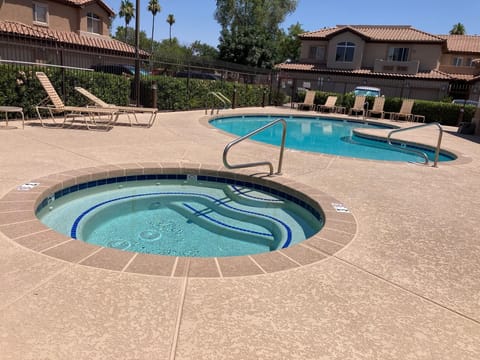 Community spa and pool directly across from unit!