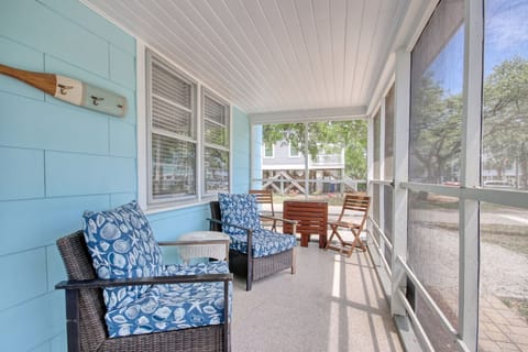 Screened porch has 4 large chairs, 2 small chairs, and expandable table.