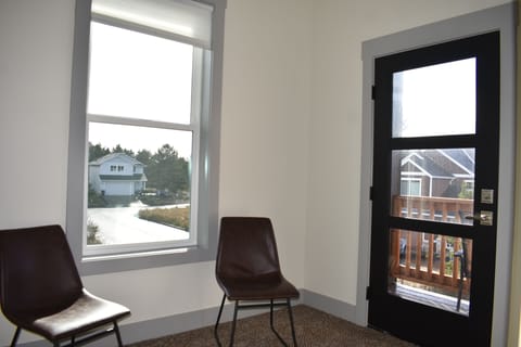 Primary Bedroom, King bed- sitting area & balcony door