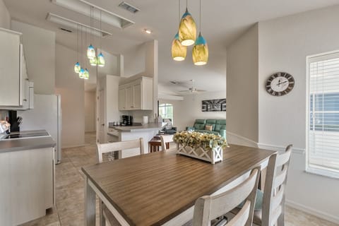 Table off the kitchen looks out to the waterfront lot.