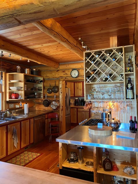 Kitchen with stainless steel and butcher block countertops.