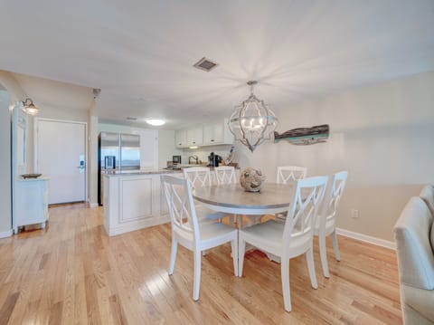 Spacious open dining area with seating for six (6).