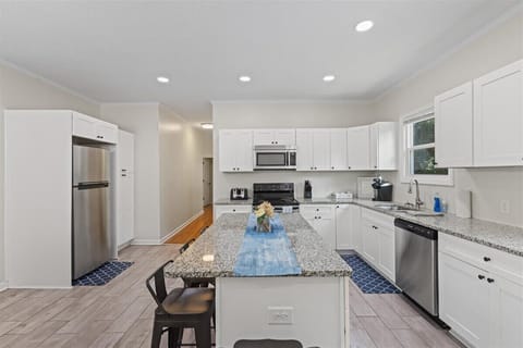 Fully equipped kitchen
with modern
appliances, cookware,
coffee maker, and
everything needed for
home cooked meals