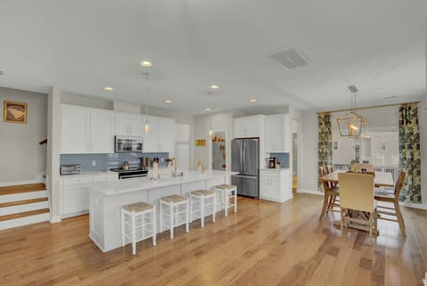 Kitchen and dining rooms with plenty of seating for family and guests. 