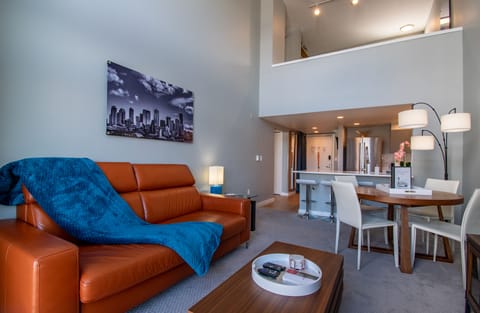 Living Room with a Large 75" TV, Vaulted Ceiling Windows & Sleeper Sofa