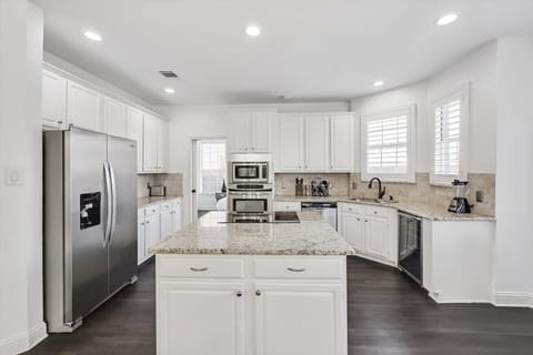 With a huge island and open-concept layout, this kitchen is undeniably the heart of the home!