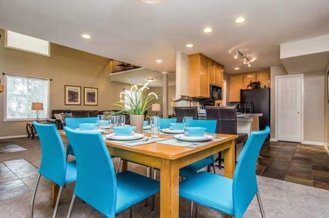 Kitchen open to dining area with table for 6