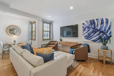 Spacious Living Room, featuring a separate Dining Area. Complete with AC, Smart TV, and comfy seating.