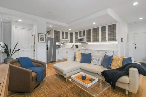 Living Room, featuring a spacious Kitchen Area. Complete with AC, Smart TV, and comfy seating.