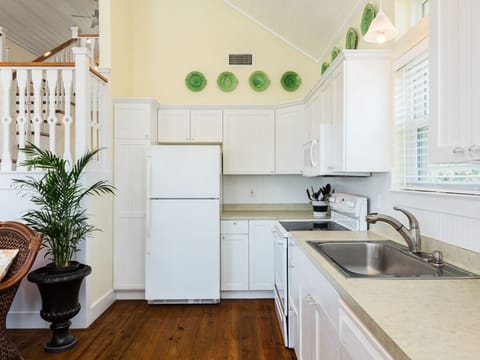 A Fully Loaded Kitchen -  With this full spread of a refrigerator, stove, and utensils, you'll have everything you need for the gourment.