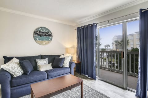 Living Area - From the large, elegant windows to the attractive furniture, you and your guests will love spending time together in this bright and airy living area.