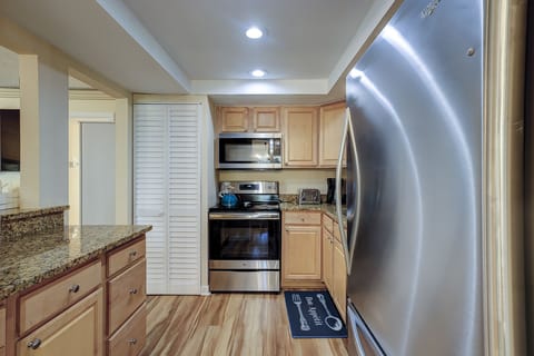 Kitchen has a brand-new Refrigerator, dishwasher, microwave, stove, plenty of dining ware, cooking utensils, eating utensils, pots and pans.