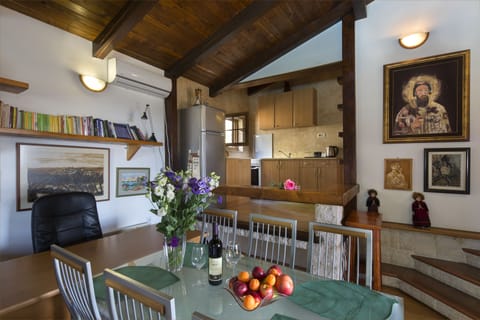 Beside the kitchen guests can use large dinning table.