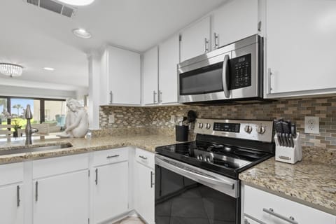 Kitchen with Granite Countertops and Stainless Steel Appliances
