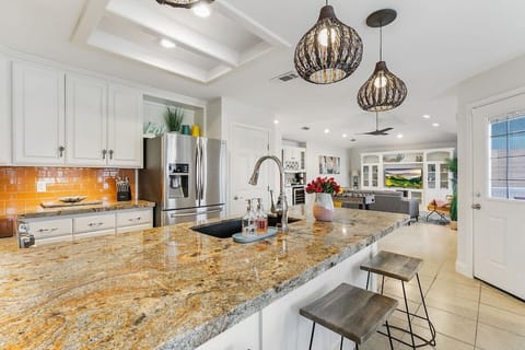 Our newly remodeled kitchen is the heart of this house, offering plenty of countertop seating for casual conversations and snacks breaks!