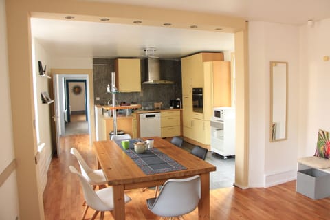 kitchen opening onto dining room
