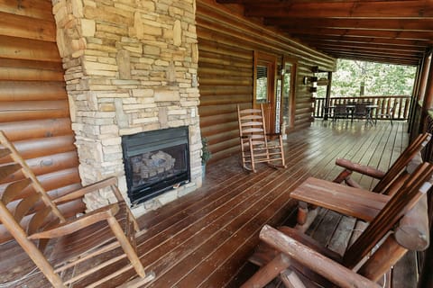 Main level wrap around porch-gas log fireplace to enjoy during cooler weather