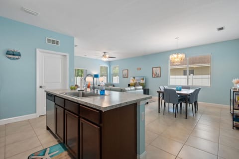 View from the kitchen lookout out to the dining and living area.