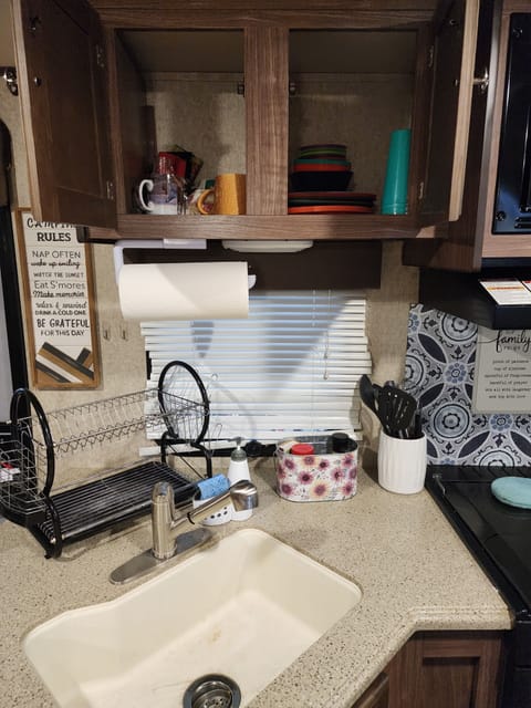 large sink. Plates, cups, mugs, etc