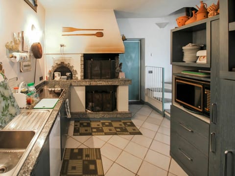 Countertop, Cabinetry, Property, Kitchen, Kitchen Stove, Interior Design, Wood, Lighting, Drawer, Floor