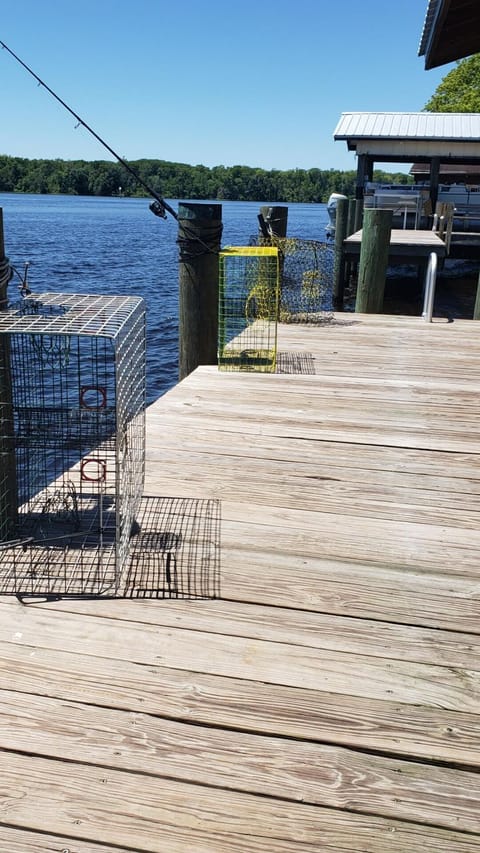 dock with crab traps and fishing pole holders
