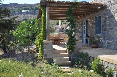 The Farm House with shaded dining terrace.